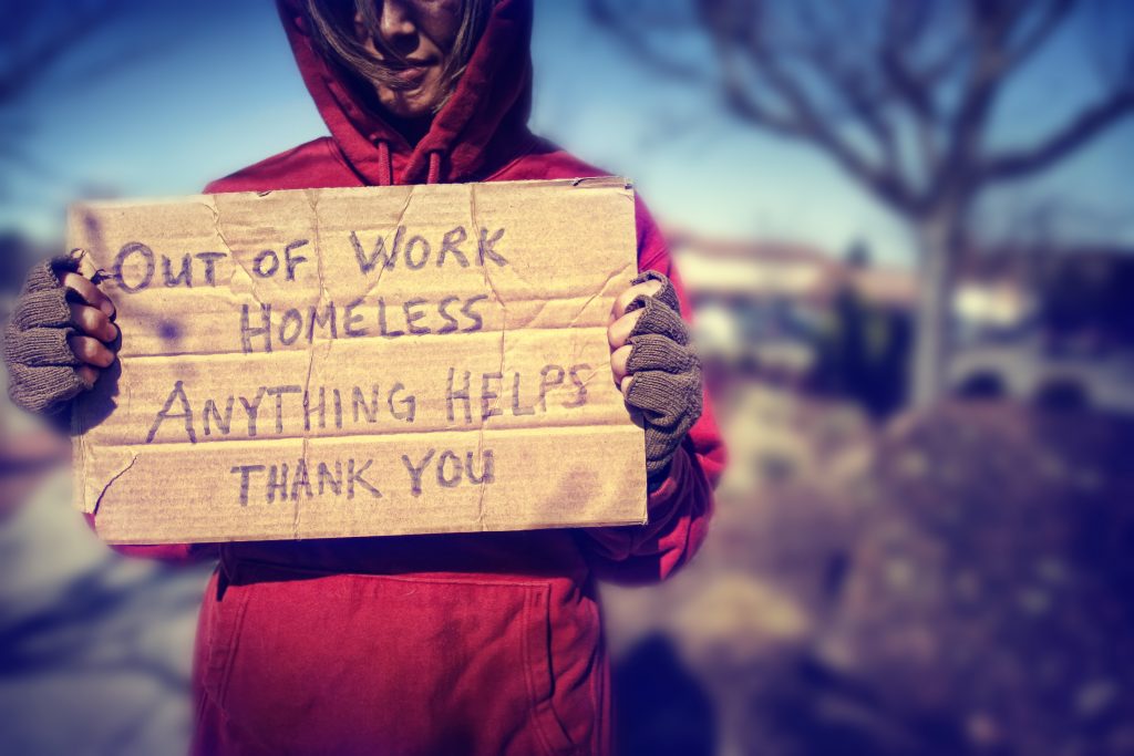 bigstock-a-homeless-person-with-a-sign-43013299.jpg